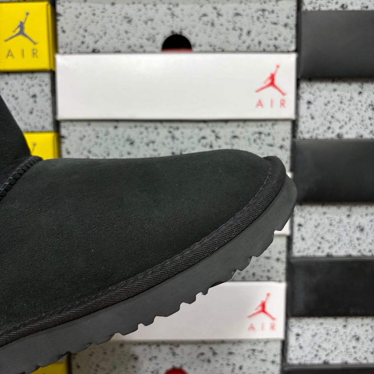 UGG Mini Bailey Bow Ankle Boot – Suede Boot with Tonal Black Shearling Lining, Black Satin Bow & All-Black Lug Sole in Black